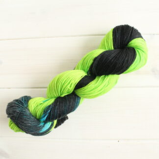 Tyrannitarred and Feathered: hand dyed sock yarn inspired by Pokemon